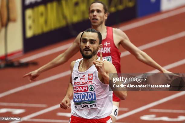 Adam Kszczot of Poland celebrates as he crosses the finish line to win the gold medal during the Men's 800 metres final on day three of the 2017...