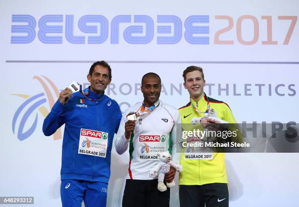 Silver medalist Fabrizio Donato of Italy , gold medalist Evora Nelson of Portugal and bronze medalist Max Hess of Germany pose during the medal...
