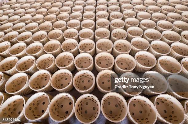 handmade pottery are arranged to be burned in a pottery workshop. - dirty oven stock pictures, royalty-free photos & images