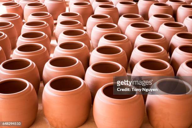 handmade pottery are arranged to be burned in a pottery workshop. - pottery kiln stock pictures, royalty-free photos & images