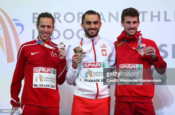 Silver medalist Andreas Bube of Denmark, gold medalist Adam Kszczot of Poland and bronze medalist Alvaro De Arriba of Spain pose during the medal...