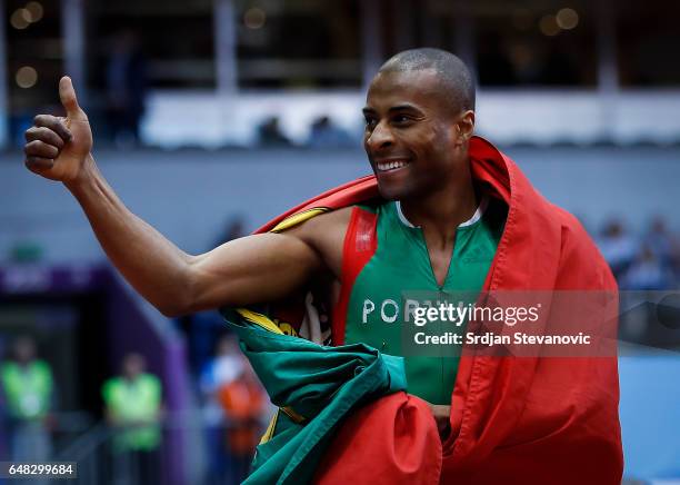 Gold medalist Nelson Evora of Portugal celebrates following the Men's Triple Jump final on day three of the 2017 European Athletics Indoor...