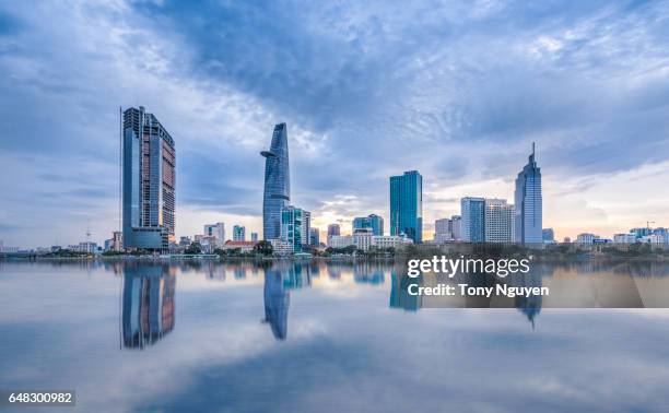 sunset over downtown saigon, ho chi minh city - the biggest city in vietnam. - modern vietnam stockfoto's en -beelden