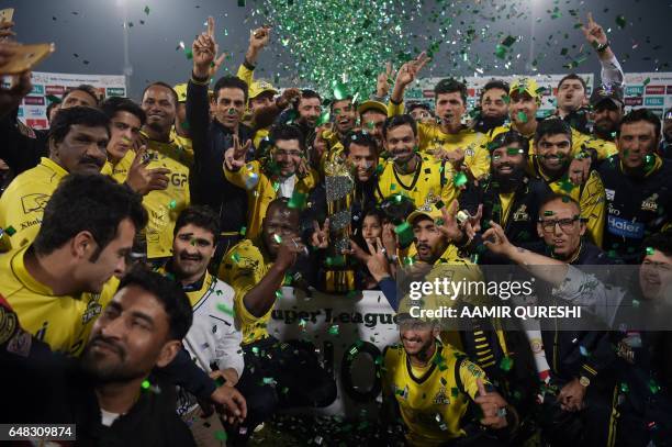 Cricketers of Peshawar Zalmi their victory over Quetta Gladiators in the final cricket match of the Pakistan Super League at The Gaddafi Cricket...