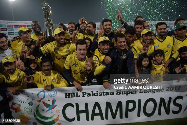 Cricketers of Peshawar Zalmi their victory over Quetta Gladiators in the final cricket match of the Pakistan Super League at The Gaddafi Cricket...