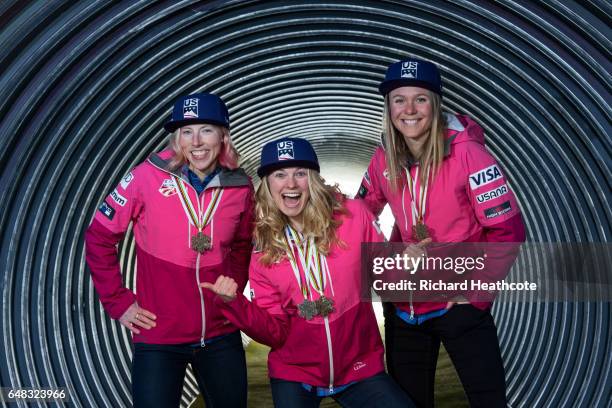 Team USA Medal winners Kikkan Randall, Jessica Diggins and Sadie Bjornsen pose for a portrait with their medals at the FIS Nordic World Ski...