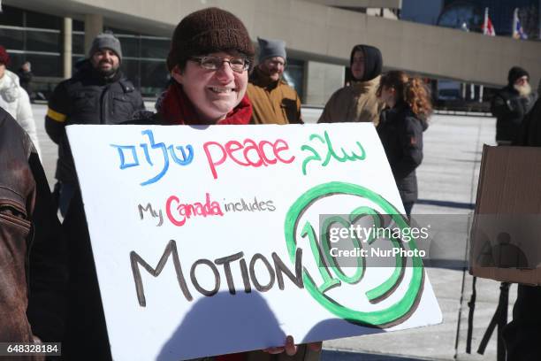 Pro-Muslim demonstrators hold a counter-protest against anti-Muslim groups over the M-103 motion to fight Islamophobia in downtown Toronto, Ontario,...