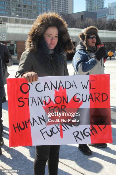 Pro-Muslim demonstrators hold a counter-protest against anti-Muslim groups over the M-103 motion to fight Islamophobia in downtown Toronto, Ontario,...