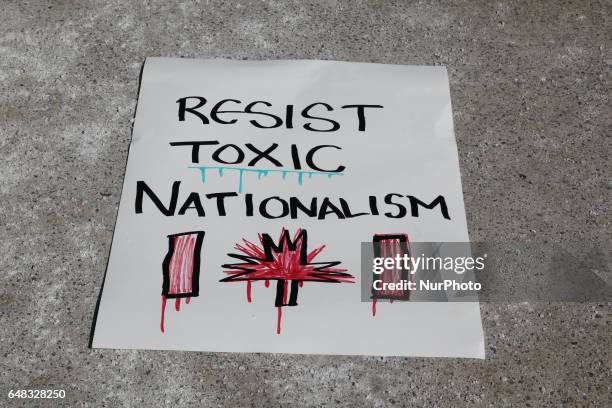 Sign saying 'Resist Toxic Nationalism' during a counter-protest against anti-Muslim groups over the M-103 motion to fight Islamophobia in downtown...