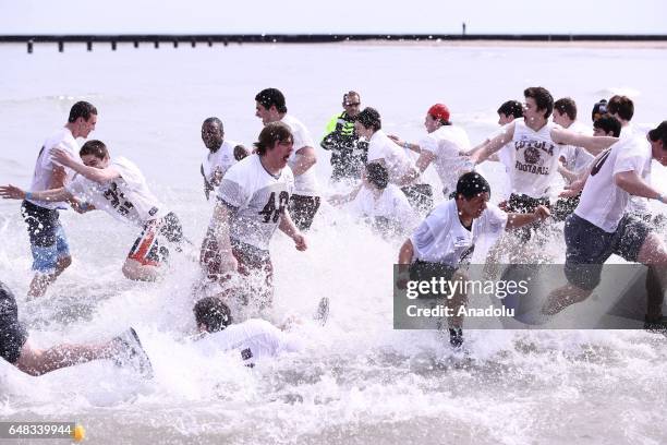 People take part in the 17th Annual Chicago Polar Plunge organized to support the athletes of Special Olympics at North Ave Beach of Michigan Lake in...