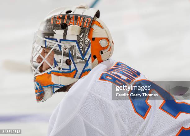 Jean-Francois Berube of the New York Islanders stretches in warm up prior to puck drop against the Calgary Flames at Scotiabank Saddledome on March...