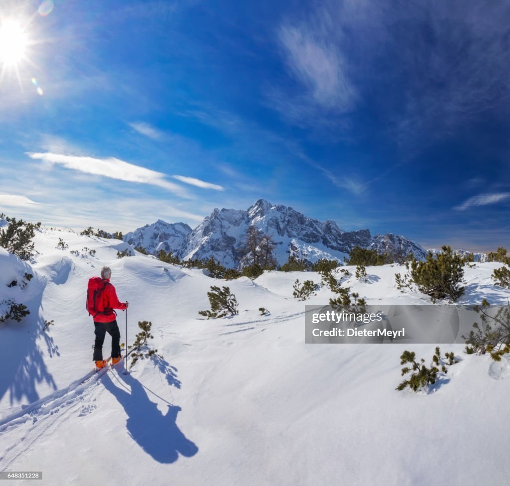 Back country skier at Watzmann with Hochkalter in Background- Alps