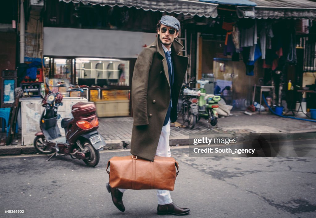 Man with a leather bag