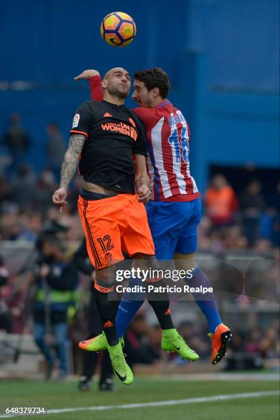 Sime Vrsaljko of Atletico de Madrid fights for the ball with Simone Zaza of Valencia during the La Liga match between Atletico de Madrid and Valencia...