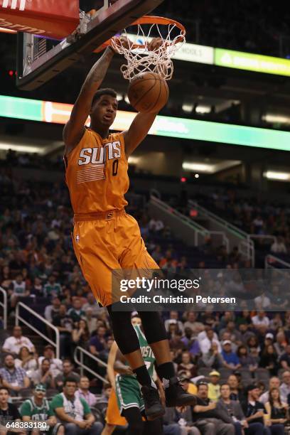 Marquese Chriss of the Phoenix Suns slam dunks the ball against the Boston Celtics during the first half of the NBA game at Talking Stick Resort...