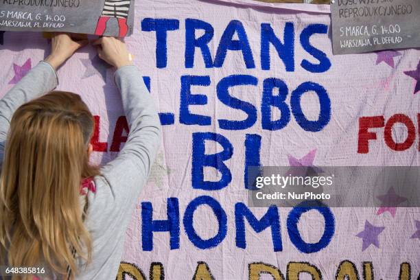 Woman during &quot;Manifa&quot; marchin Warsaw on March 5, 2017. People take part in a protest to mark the International Women's Day, 3 days early,...