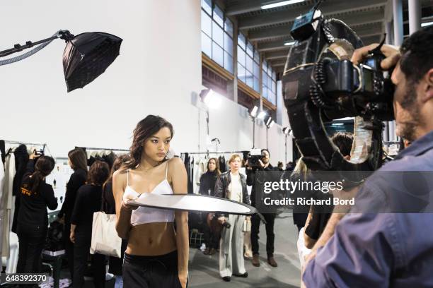 Model Lameka Fox poses for a photographer backstage before the Akris show at Palais de Tokyo as part of the Paris Fashion Week Womenswear Fall/Winter...