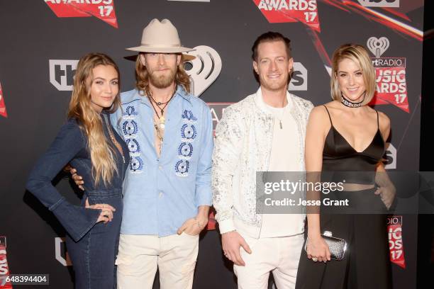 Musicians Brian Kelley and Tyler Hubbard of Florida Georgia Line with Brittney Marie Cole and Hayley Stommel attend the 2017 iHeartRadio Music Awards...