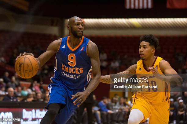 Courtney Fells of the Westchester Knicks drives against Mike Williams of the Canton Charge at the Canton Memorial Civic Center on March 5, 2017 in...