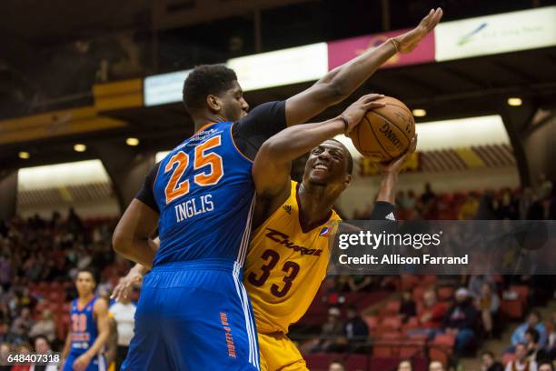 Jonathan Holmes of the Canton Charge looks to shoot through coverage by Damien Inglis of the Westchester Knicks at the Canton Memorial Civic Center...