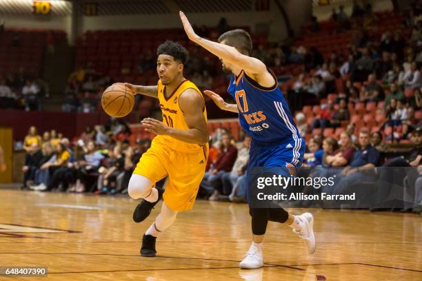 Mike Williams of the Canton Charge drives against Joey Miller of the Westchester Knicks at the Canton Memorial Civic Center on March 5, 2017 in...