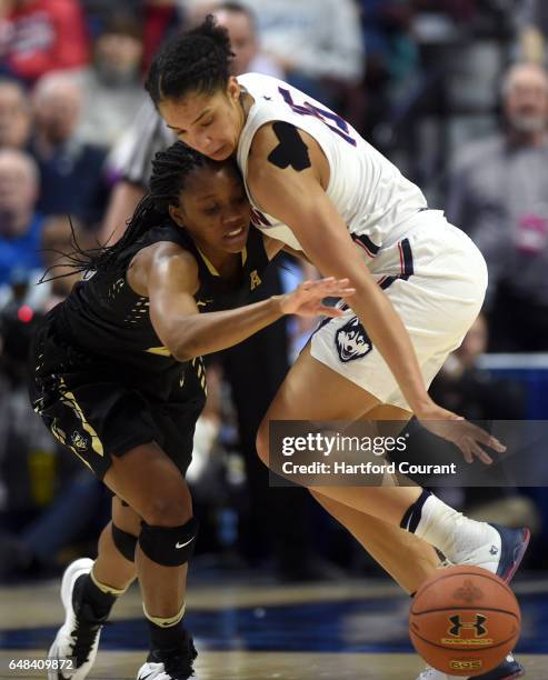 Connecticut Huskies guard Gabby Williams steals the ball from UCF Knights guard Zykira Lewis in a semifinal game of the AAC Women's Basketball...