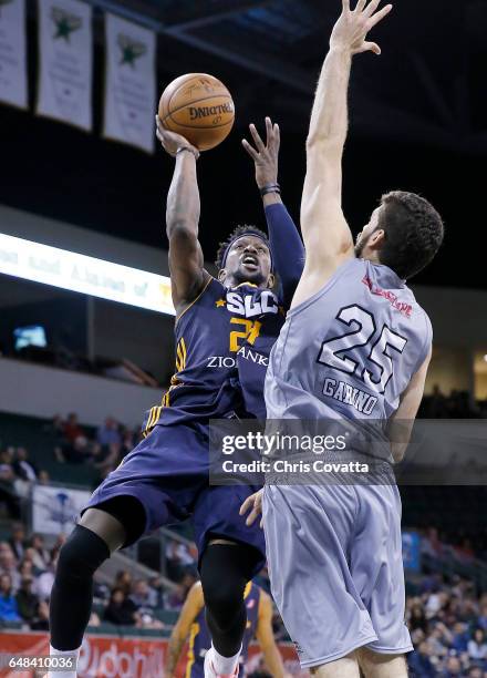 Jermaine Taylor of the Salt Lake City Stars shoots the ball against Patricio Garino of the Austin Spurs at the H-E-B Center At Cedar Park on March 5,...