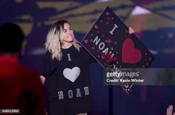 Singer Miley Cyrus speaks onstage at the 2017 iHeartRadio Music Awards which broadcast live on Turner's TBS, TNT, and truTV at The Forum on March 5,...