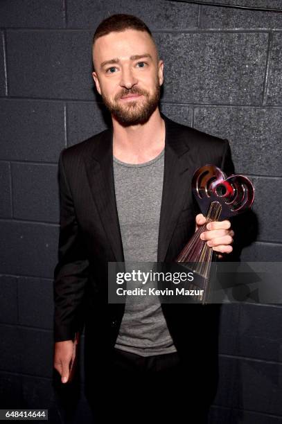 Singer Justin Timberlake poses with the Song of the Year award for 'Can't Stop The Feeling' at the 2017 iHeartRadio Music Awards which broadcast live...