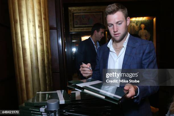 Jack Sock signs autographs during the USTA Foundation WTD Player Cocktail Reception at JW Marriott Essex House on March 5, 2017 in New York City.