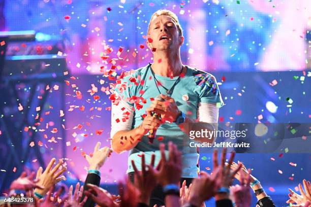 Singer Chris Martin performs onstage at the 2017 iHeartRadio Music Awards which broadcast live on Turner's TBS, TNT, and truTV at The Forum on March...