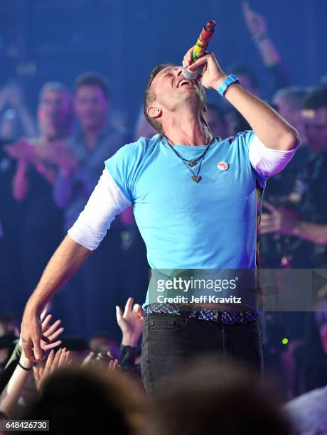 Singer Chris Martin performs onstage at the 2017 iHeartRadio Music Awards which broadcast live on Turner's TBS, TNT, and truTV at The Forum on March...