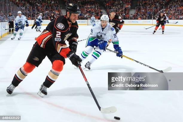 Kevin Bieksa of the Anaheim Ducks skates with the puck against Joseph Cramarossa of the Vancouver Canucks during the game on March 4, 2017 at Honda...