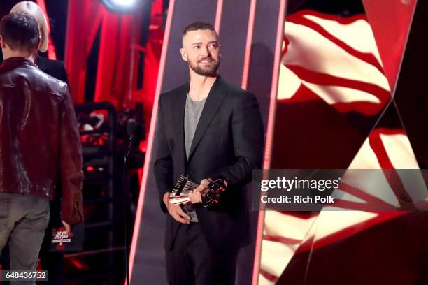 Singer Justin Timberlake accepts the Song of the Year award for 'Can't Stop The Feeling' from actor Jeremy Renner onstage at the 2017 iHeartRadio...