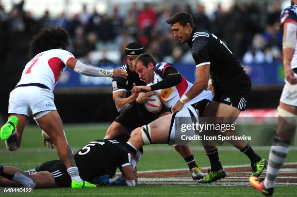 New Zealand player Ambrose Curtis, right, tackles United States player Ben Pinkelman during their sevens rugby match at the HSBC USA Sevens rugby...