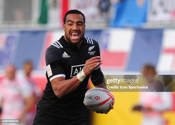 New Zealand player Sione Molia scores a try against the United States during their sevens rugby match at the HSBC USA Sevens rugby tournament on...