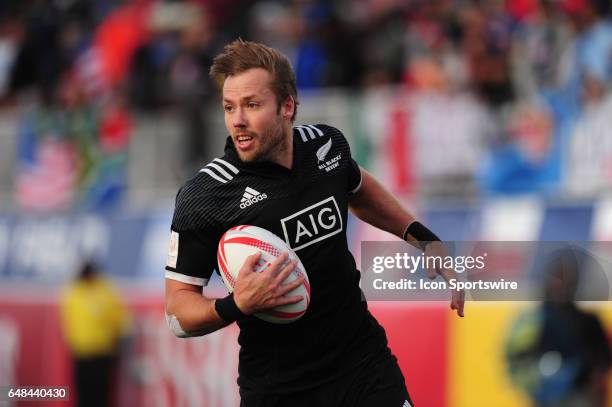 New Zealand player Tim Mikkelson scores a try against the United States during their sevens rugby match at the HSBC USA Sevens rugby tournament on...