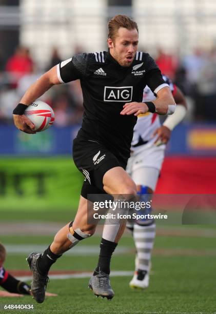 New Zealand player Tim Mikkelson scores a try against the United States during their sevens rugby match at the HSBC USA Sevens rugby tournament on...