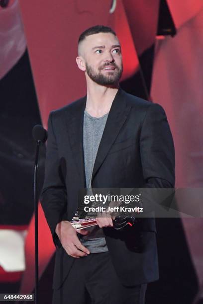 Singer Justin Timberlake accepts the Song of the Year award for 'Can't Stop The Feeling' from actor Jeremy Renner onstage at the 2017 iHeartRadio...