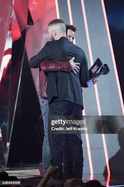 Singer Justin Timberlake accepts the Song of the Year award for 'Can't Stop The Feeling' from actor Jeremy Renner onstage at the 2017 iHeartRadio...