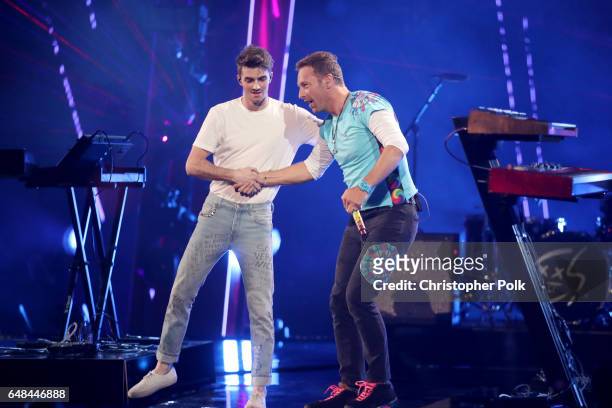 Recording artists Andrew Taggart of The Chainsmokers and Chris Martin perform onstage at the 2017 iHeartRadio Music Awards which broadcast live on...