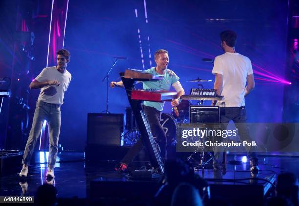 Recording artist Chris Martin performs with recording artists Andrew Taggart and Alex Pall of The Chainsmokers onstage at the 2017 iHeartRadio Music...