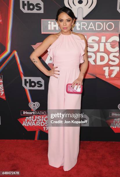 Actress Janel Parrish arrives at the 2017 iHeartRadio Music Awards at The Forum on March 5, 2017 in Inglewood, California.