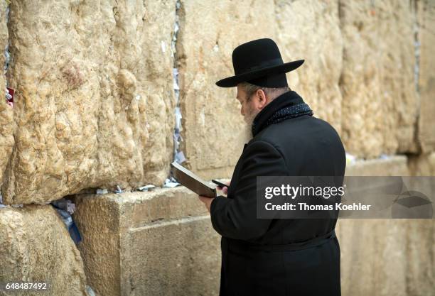 Jerusalem, Israel A Jewish man is praying on the Wailing Wall in the historic city center of Jerusalem on February 08, 2017 in Jerusalem, Israel.