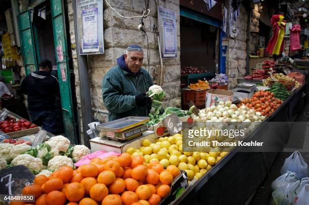 Jerusalem, Israel A street hawker sells fruit and vegetables at the Mahane Yehuda market in Jerusalem on February 08, 2017 in Jerusalem, Israel.