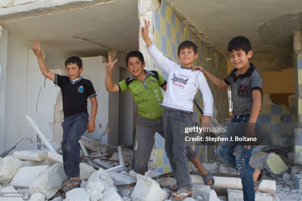 Syria. Play A'ZAZ, ALEPPO, SYRIA - : Syrian children play at the border with ...