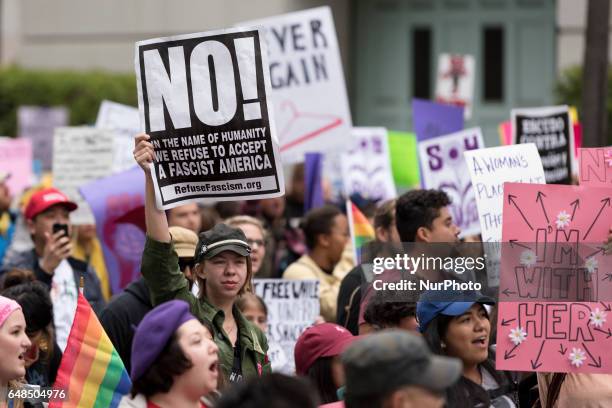 Activists gather in downtown Los Angeles to mark the International Women's Day that celebrates womens achievements while calling for gender equality....