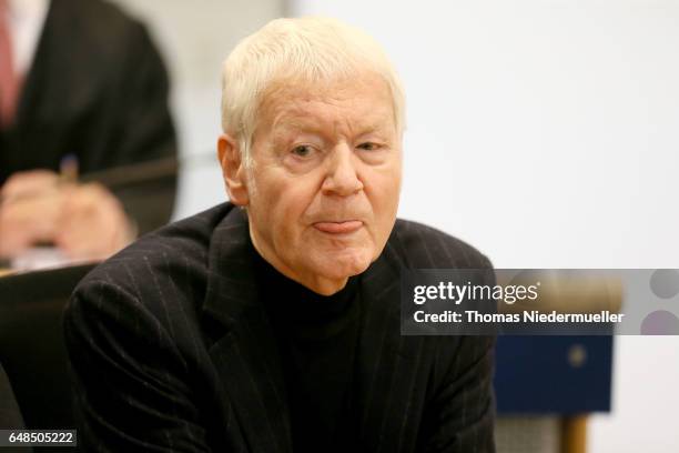 Anton Schlecker, founder of the now bankrupt German drugstore chain Schlecker, arrives with his lawyer for the first day of his trial on March 6,...