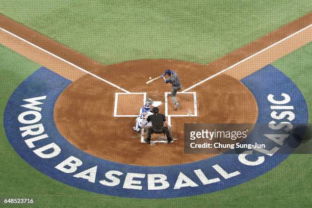 Sam Fuld of Israel hits a liner to center fielder in the first inning of the World Baseball Classic Pool A Game One between Israel and South Korea at...