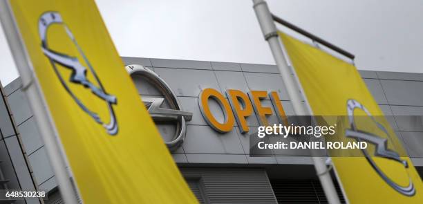 The logo of German car maker Opel is pictured at its headquarters in Ruesselsheim, on March 6, 2017. The imminent takeover of General Motors'...